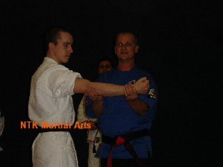Master Davy Hogan demonstrates on Mark.